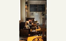 Traditional pub seating, mix-matched chairs in a relaxed enviromet